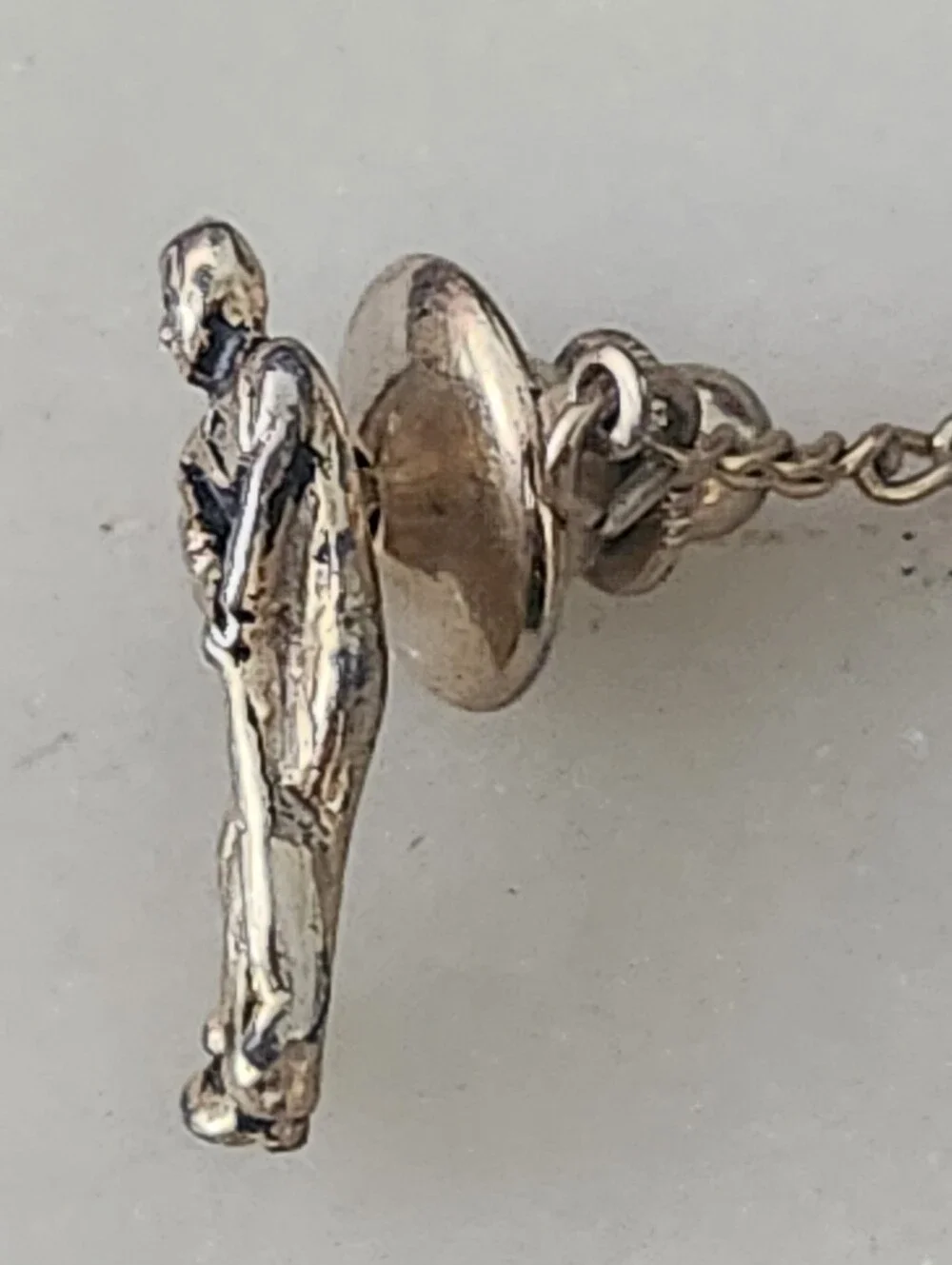 Gold-Tone Golfer Hitting Ball Figure Lapel Pin